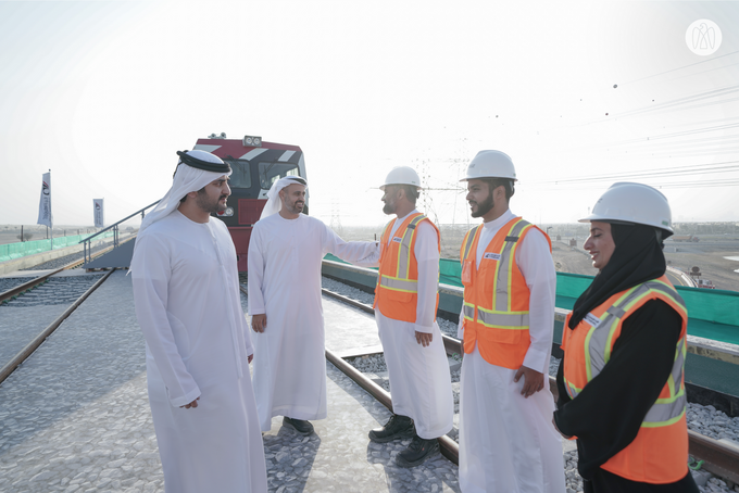 Maktoum bin Mohammed bin Rashid and Theyab bin Mohamed bin Zayed witness the connection of Abu Dhabi and Dubai with a direct railway within the “UAE National Rail Network”