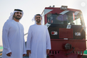 Maktoum bin Mohammed bin Rashid and Theyab bin Mohamed bin Zayed witness the connection of Abu Dhabi and Dubai with a direct railway within the “UAE National Rail Network”