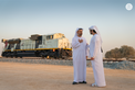 Maktoum bin Mohammed bin Rashid and Theyab bin Mohamed bin Zayed witness the connection of Abu Dhabi and Dubai with a direct railway within the “UAE National Rail Network”