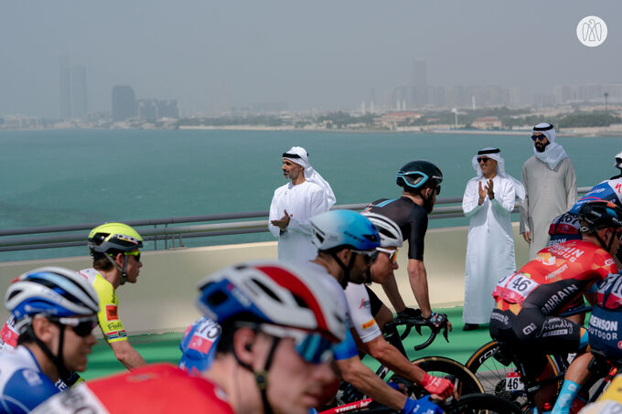 Khaled bin Mohamed bin Zayed greets cyclists starting stage two of the UAE Tour from Abu Dhabi’s Hudayriyat Island