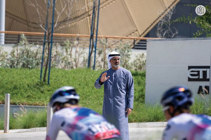 Khaled bin Mohamed bin Zayed greets cyclists participating in Stage 6 of UAE Tour 2023