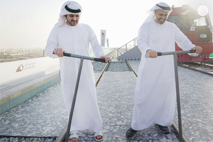 Maktoum bin Mohammed bin Rashid and Theyab bin Mohamed bin Zayed witness the connection of Abu Dhabi and Dubai with a direct railway within the “UAE National Rail Network”